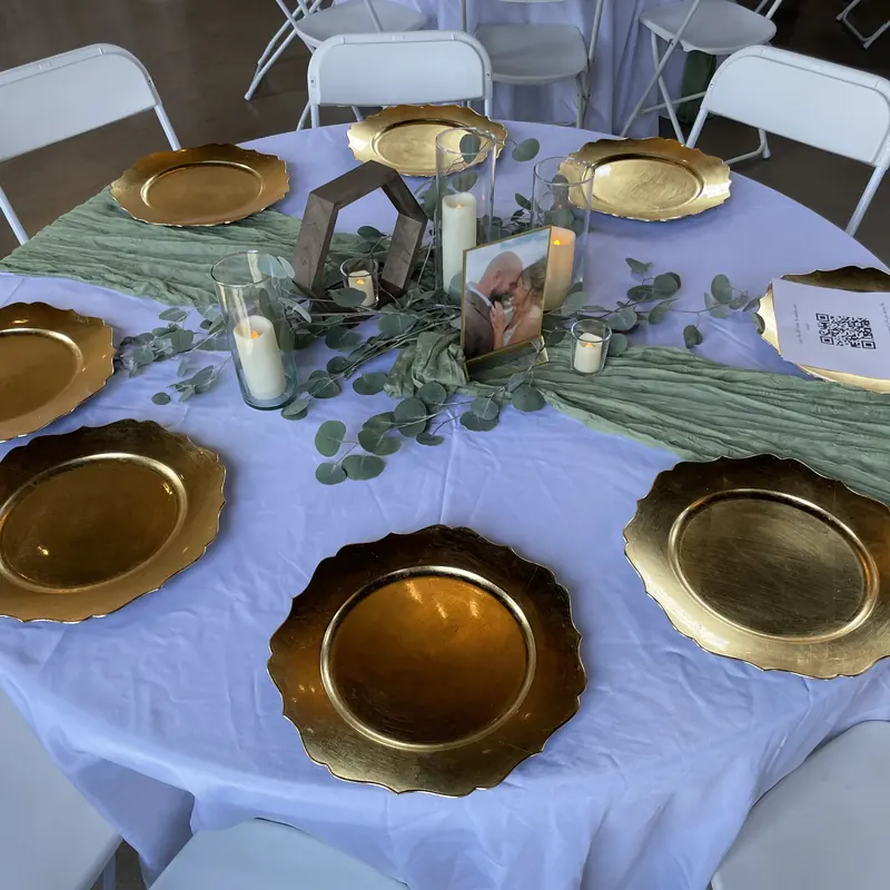 Gold chargers on lavender linen with a sage runner