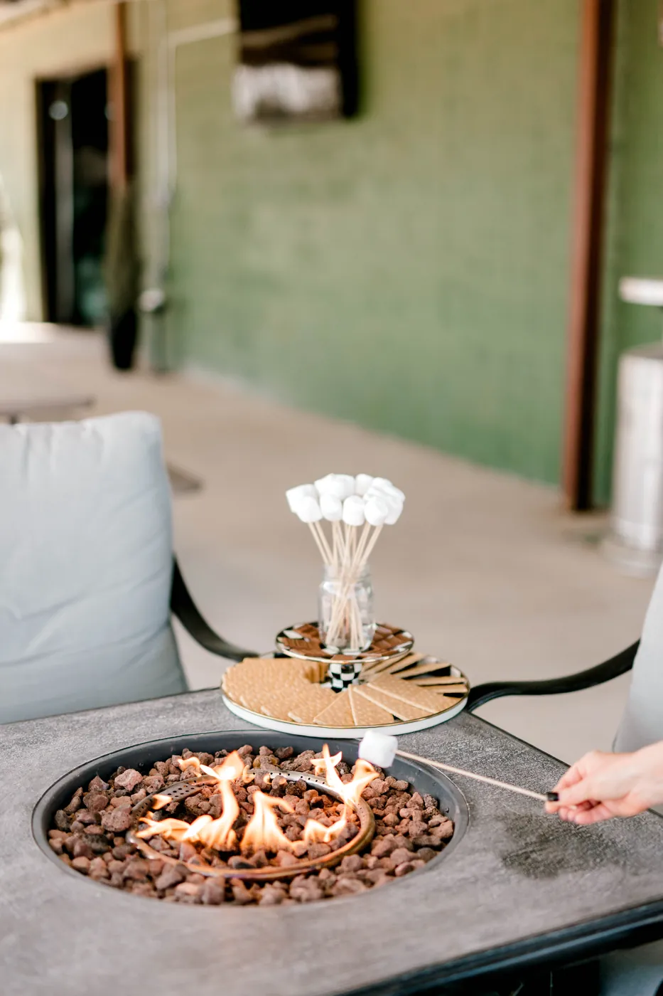 Toasting marshmallows over the propane fire pit