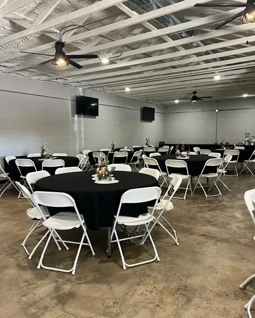 Hall set with black linens for dinner